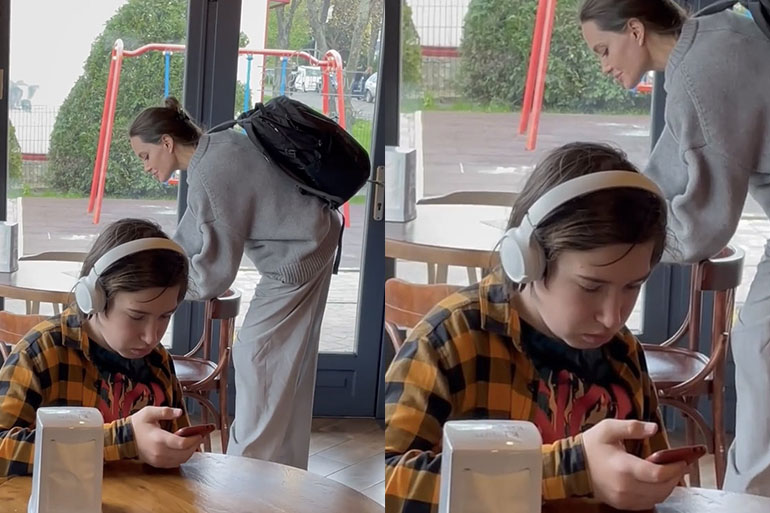 Guy in Headphones in Front of Angelina Jolie