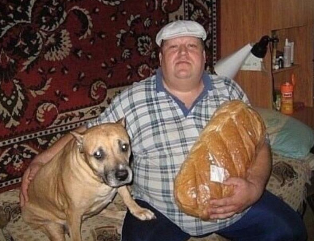 Man with a Loaf of Bread and a Dog
