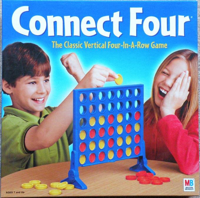 Дети играют в настольную игру Connect Four