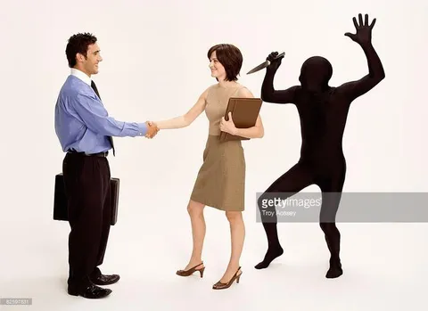 Black Figure With a Knife