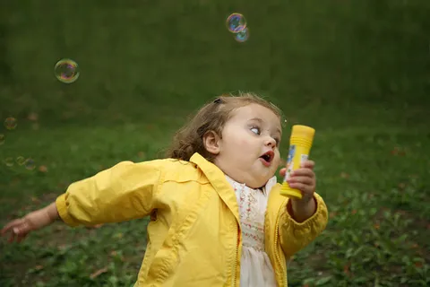 Girl with Soap Bubbles